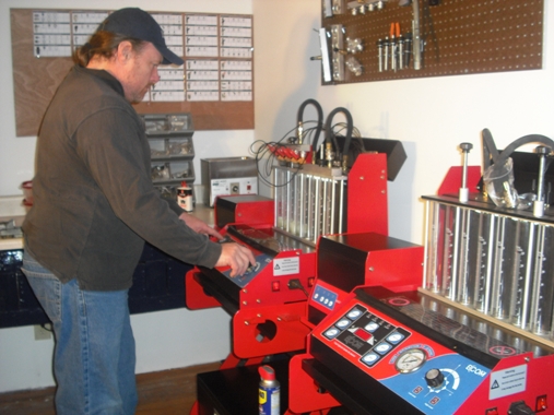 Our two computerized ECCOM fuel injector cleaning and flow testing bench units.